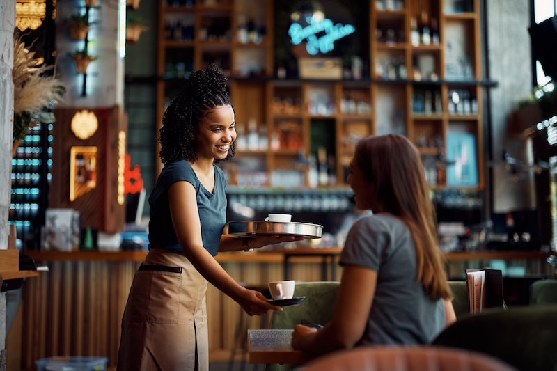 Hospitality photo - barista serving coffee